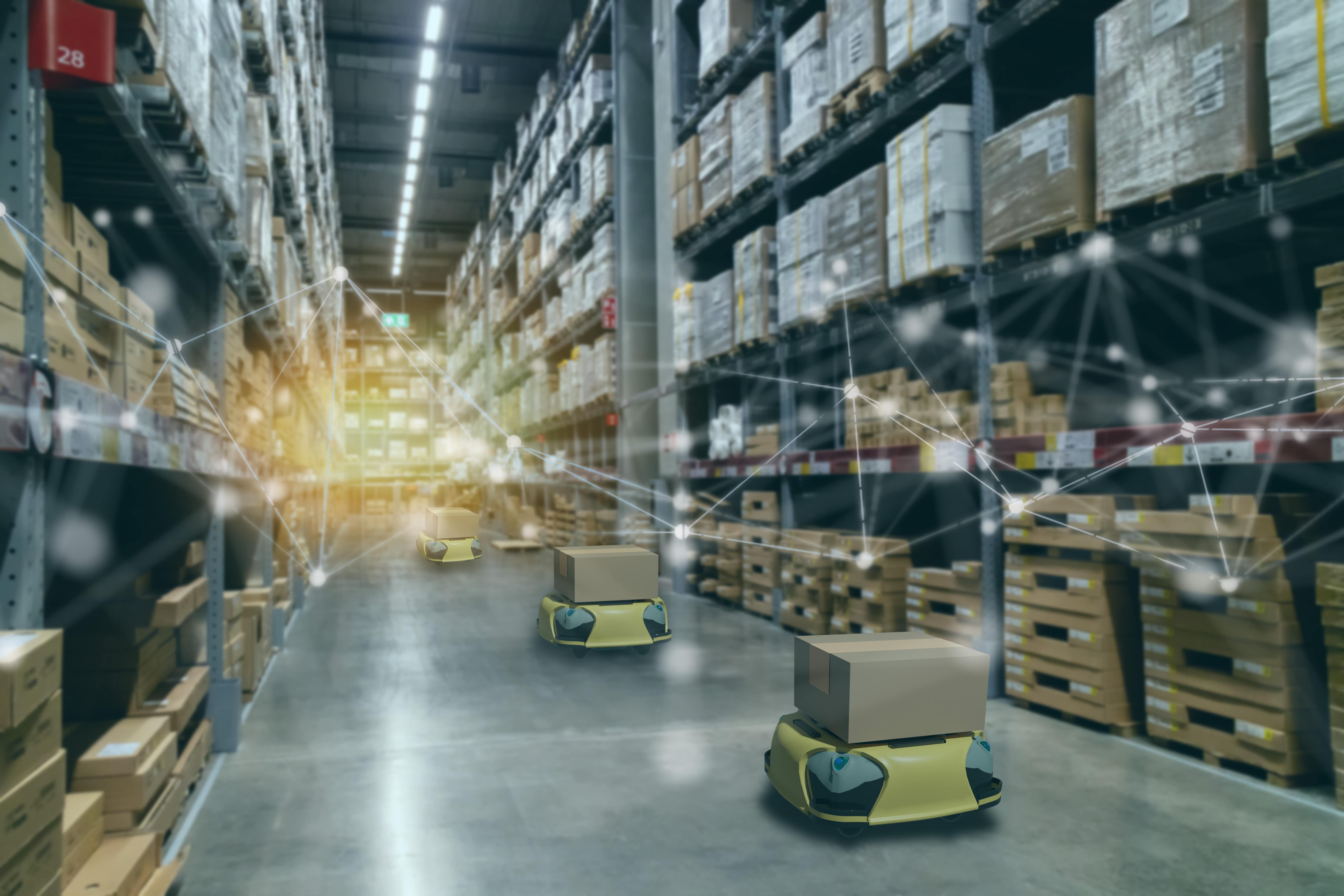 warehouse product moving robots working alongside staff