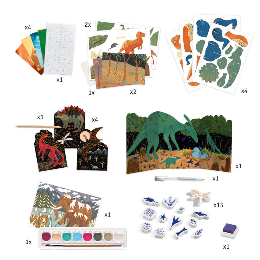 The Djeco World of Dinosaurs contents spread out. The top row shows colored sheets, background pages, and cut-out piece sheets. Middle row shows scratch pages, a scratching stick, a large tri-fold scene page, and a pen. The bottom row shows a paint tray with brush, a mammoth project sheet, stamps, and a stamp pad.