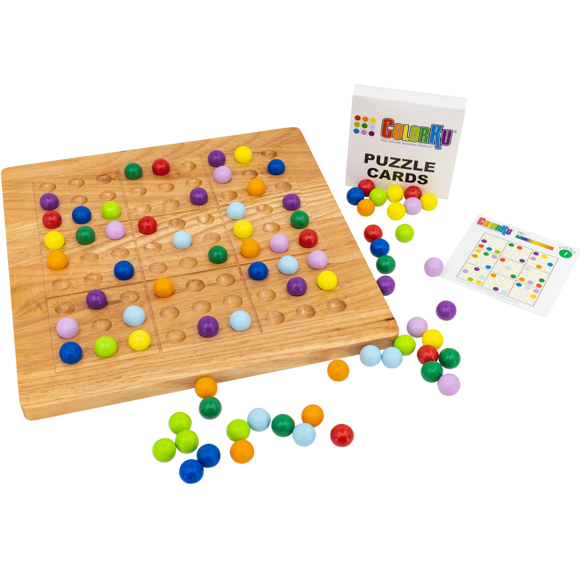 The wooden ColorKu board with several pieces in place on top. Off to the right is the card pack with 1 card laying off to the side. Spread all over the surface are many colored, wooden balls. The colored balls are red, orange, yellow, bright green, dark green, light blue, dark blue, light purple, and dark purple.