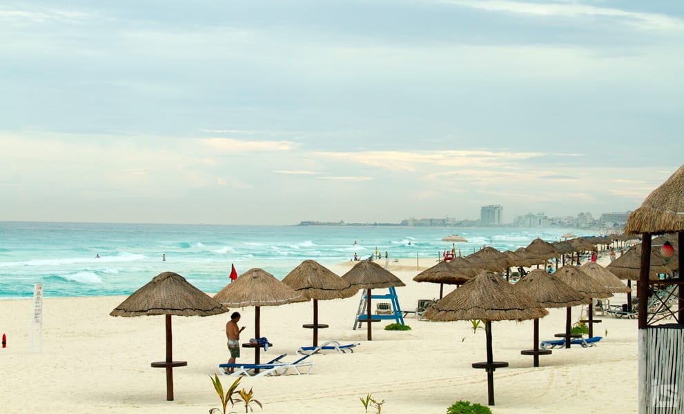 palapas and white sandy beaches of Cancun Mexico 