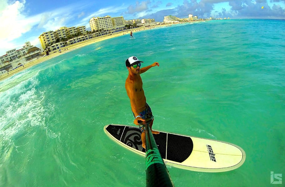 isle team rider marc paddle boards far from shore in Cancun Mexico