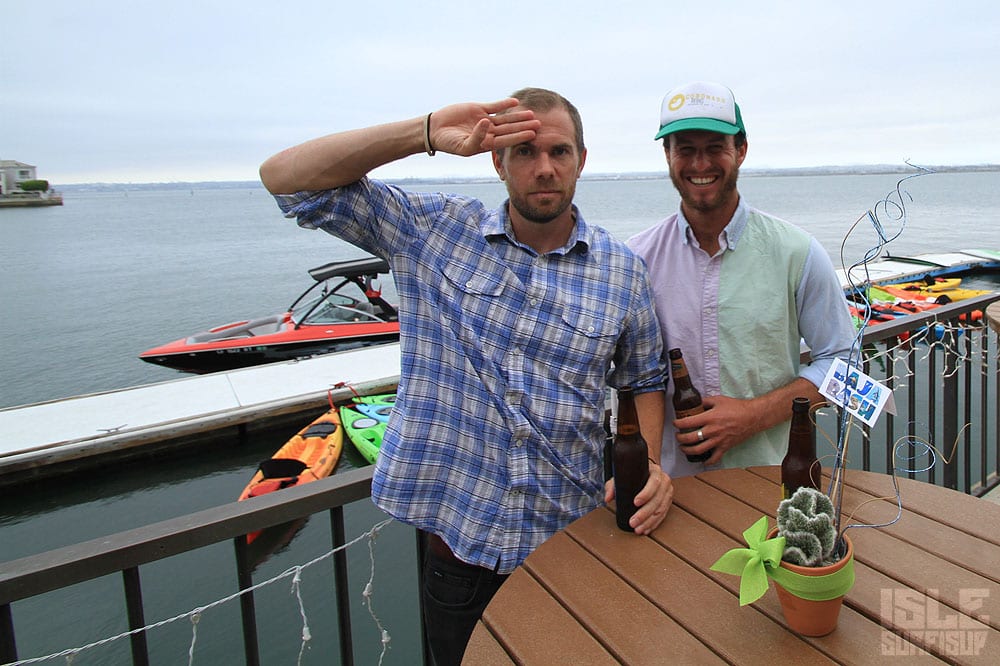 isle crew members evan and craig have a refreshing libation at the race