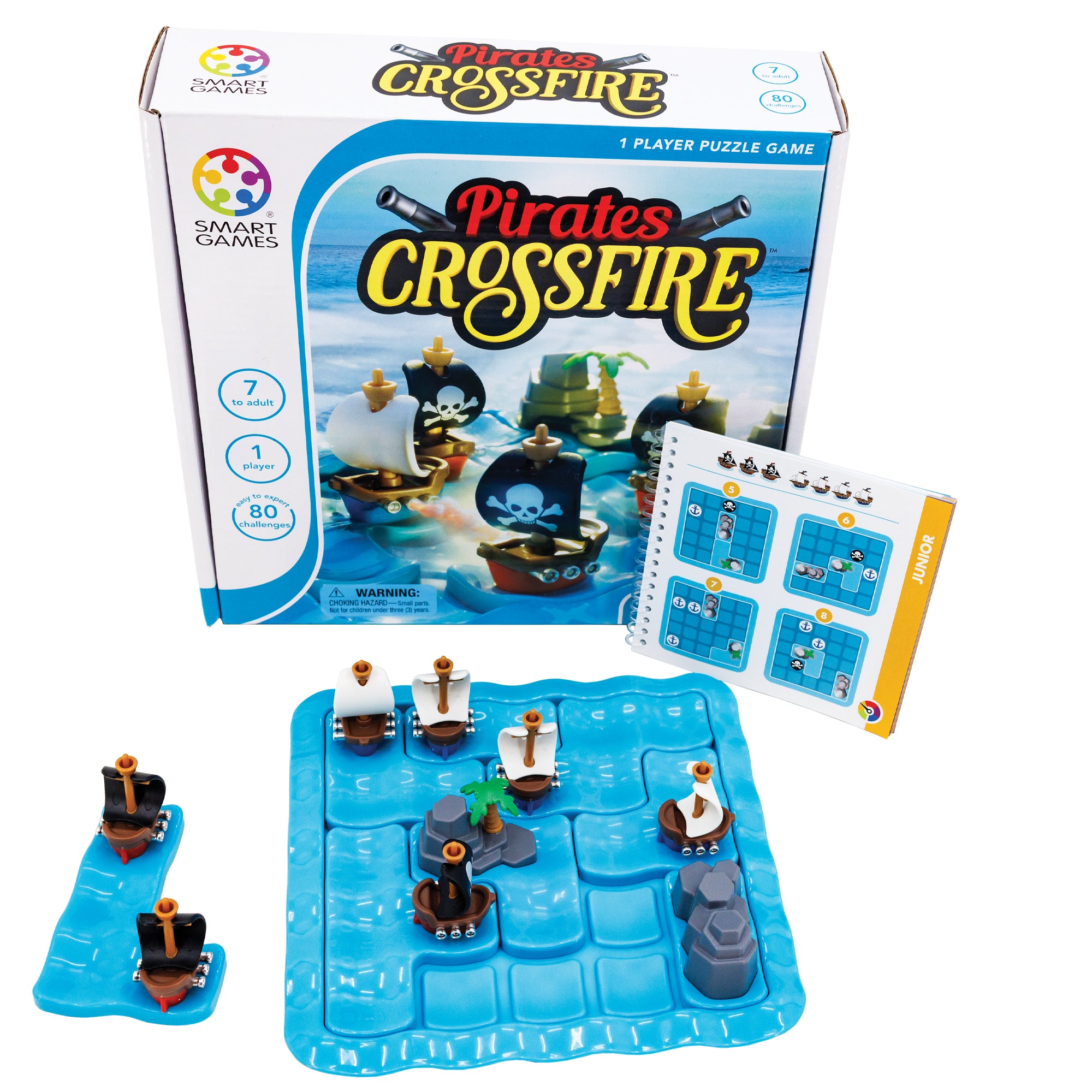 Pirates Crossfire game. The box is standing up with the instruction booklet propped up against it. In front, is the actual game board with pieces in place and one piece off to the side. The game board is blue with ship and rock pieces placed on top. There are 3 black sail ships and 2 white sail ships. The box shows a close up of the game board with pieces on top and an ocean in the background.