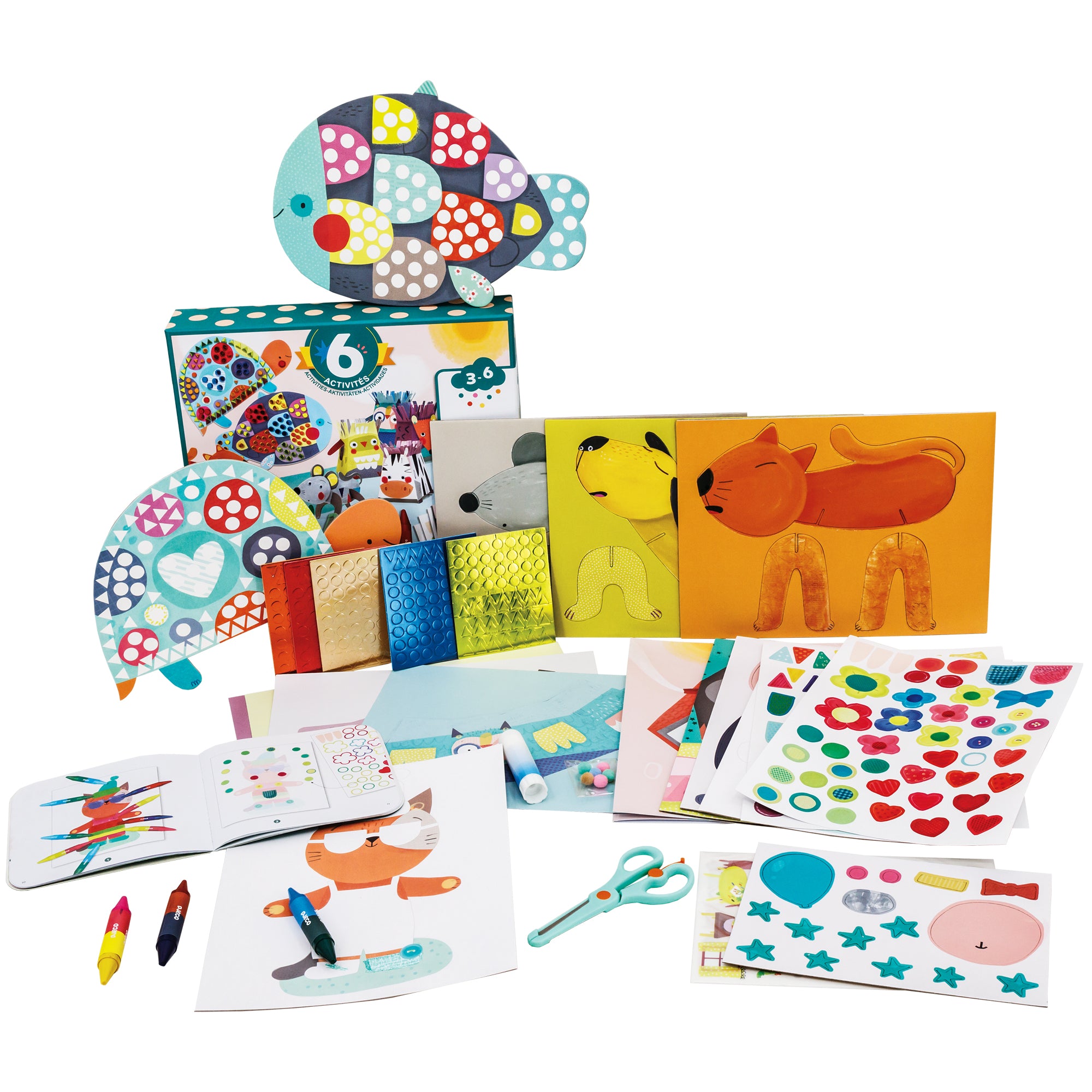 The Djeco Animals and Their Homes, Multi-Activity Box with contents all spread out. On top of the box in the back is a large fish and a turtle laid up against the box. On the box and off to the right are foil dot sticker sheets and 3 D animal sheets. Laid out on the surface in front are the instruction book, crayons, sticker sheets, scissors, and project sheets.