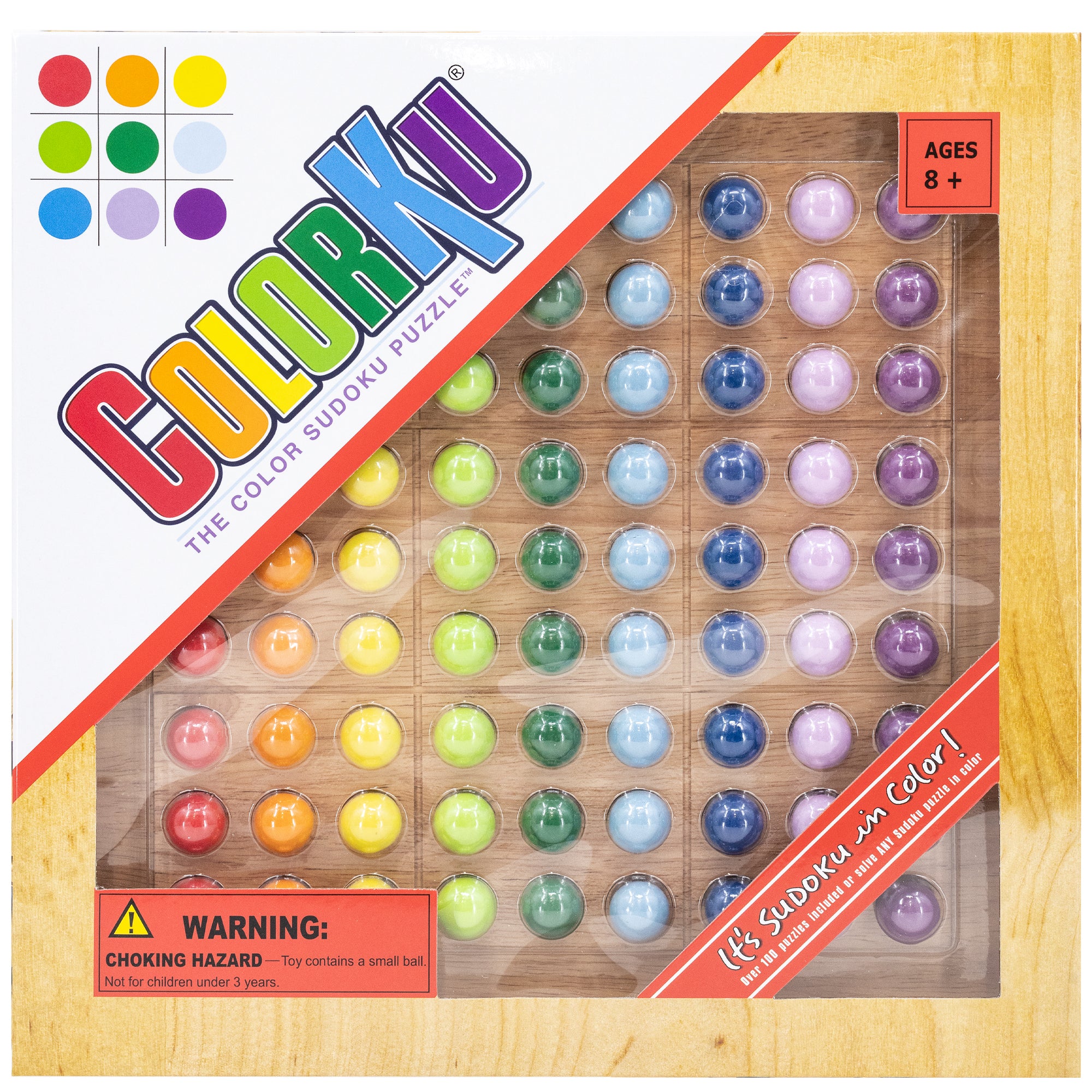 ColorKu packaging standing up to show the items inside. The title and logo are diagonally placed in the top-left. There is a wood-colored border around the outside and a large window on the rest of the top, showing the wooden game board with the pieces in place. The colored balls on the board are red, orange, yellow, bright green, dark green, light blue, dark blue, light purple, and dark purple.