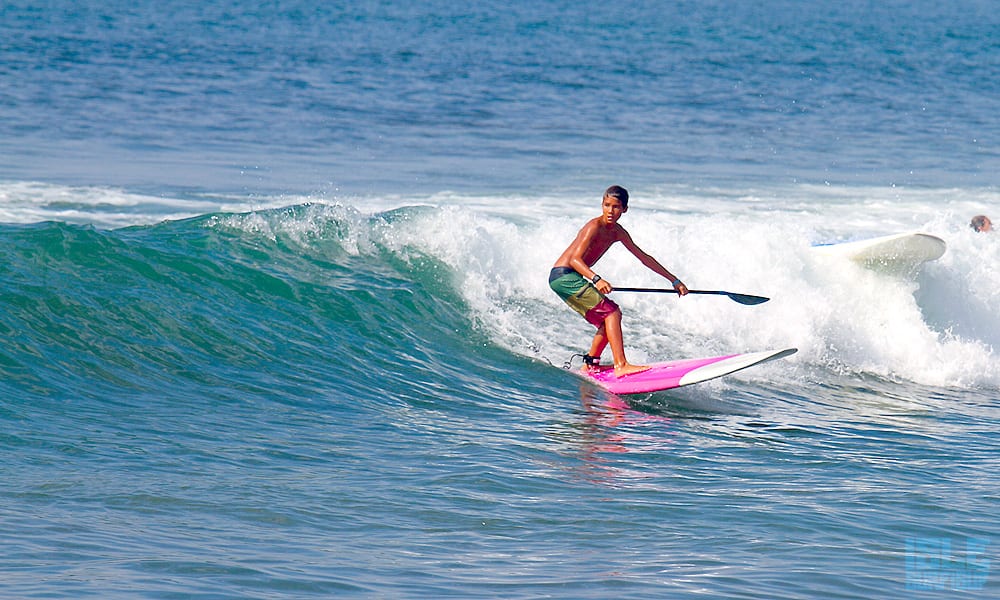 a grom testing out a kids versa paddle board sayulita mexico