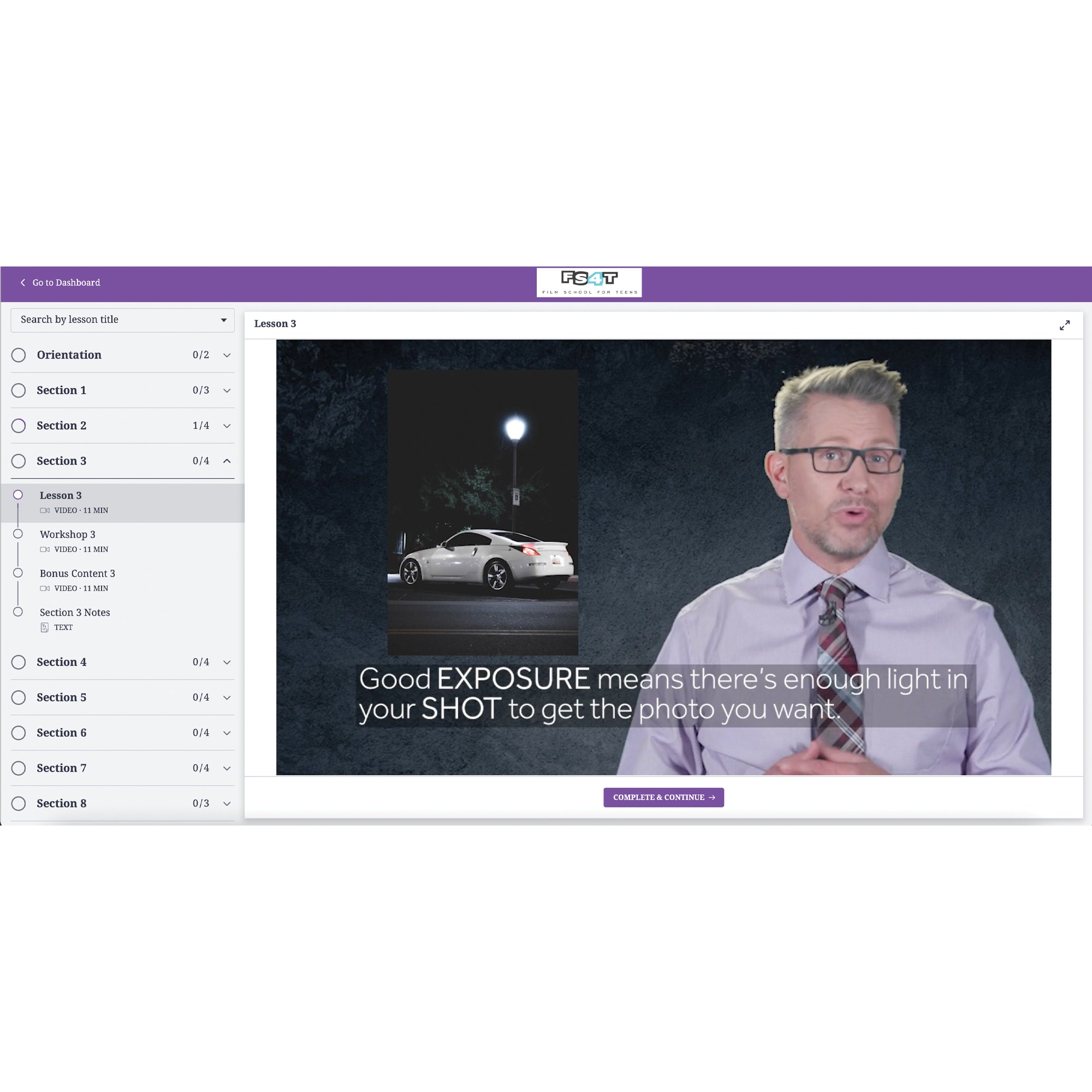 A screenshot from the Photography 4 Teens program. There is a menu on the left and the background is a white with a bright purple boarder at the top and a button at the bottom. The middle of the screen shows a screenshot of a gray-haired man with glasses and a necktie in the middle of talking. To the upper-left of him is a picture of a white car in the night parked under a street lamp. The words across the screen reads “Good EXPOSURE means there’s enough light in your SHOT to get the photo you want.”