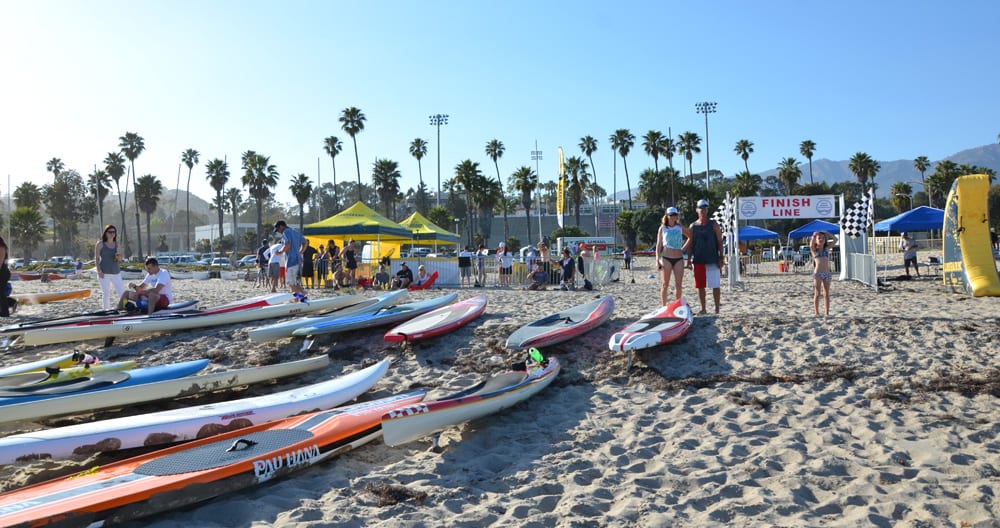 the paddle racers prepare their boards on the beach in santa barbara