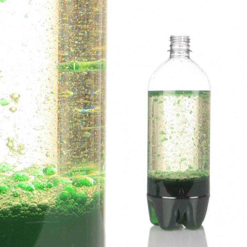 The picture shows 2 images. The image on the right is a plastic bottle with green colored oil on the bottom with clear water on top, but has may green oil bubbles floating throughout the water. On the left of the screen is a close up for the green oil floating around in the water bottle. The oil is colored by Color Fizzers.
