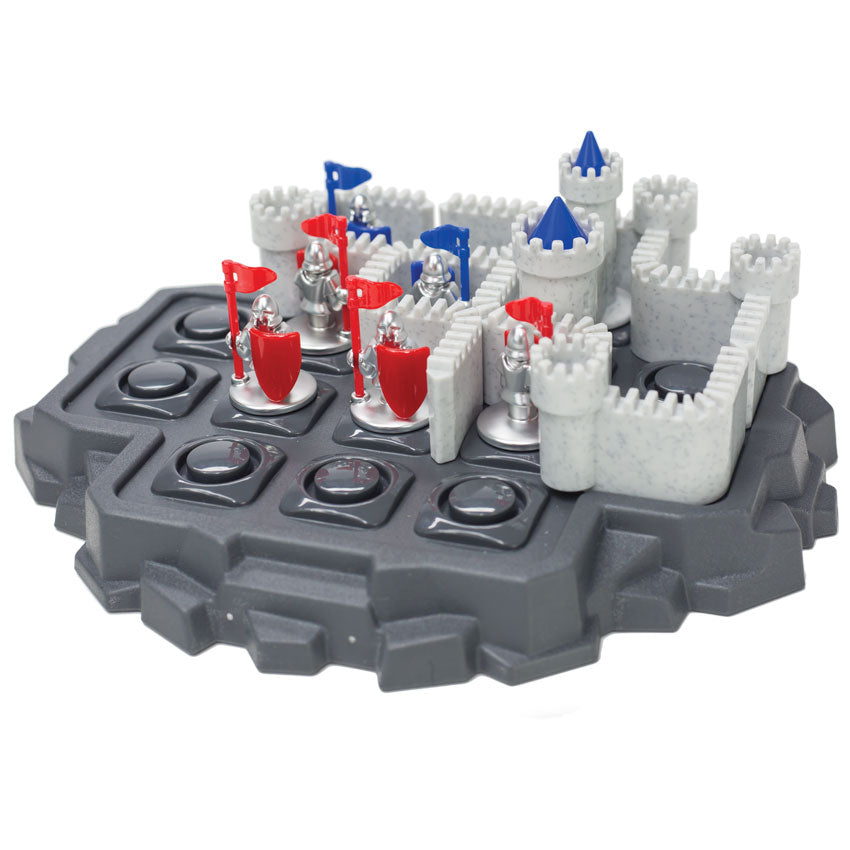 Walls & Warriors game. The game base looks like a gray rock island with circles cut into squares on the top, allowing game pieces to be put in place. There are castle wall pieces and silver knight pieces with red and blue flags and shields. There are several wall and knight pieces placed on the board.