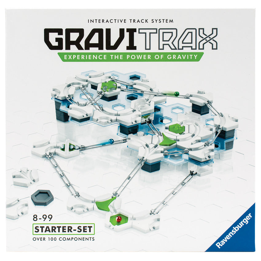 The GraviTrax set box cover. The pieces on the box are mainly hexagon shapes, with rails for marble pieces to roll through. Some of the hexagon pieces are stacked to form towers, so it gives it different levels that the marbles can roll from top to bottom through a series of obstacles.