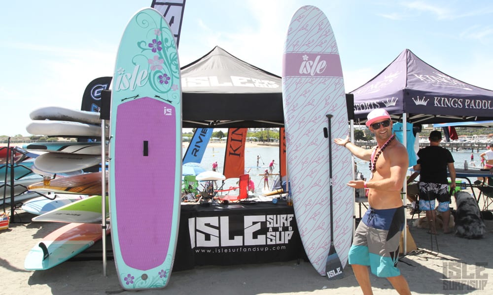 team member dirk shows off the isle inflatable sup and soft serve boards newport beach
