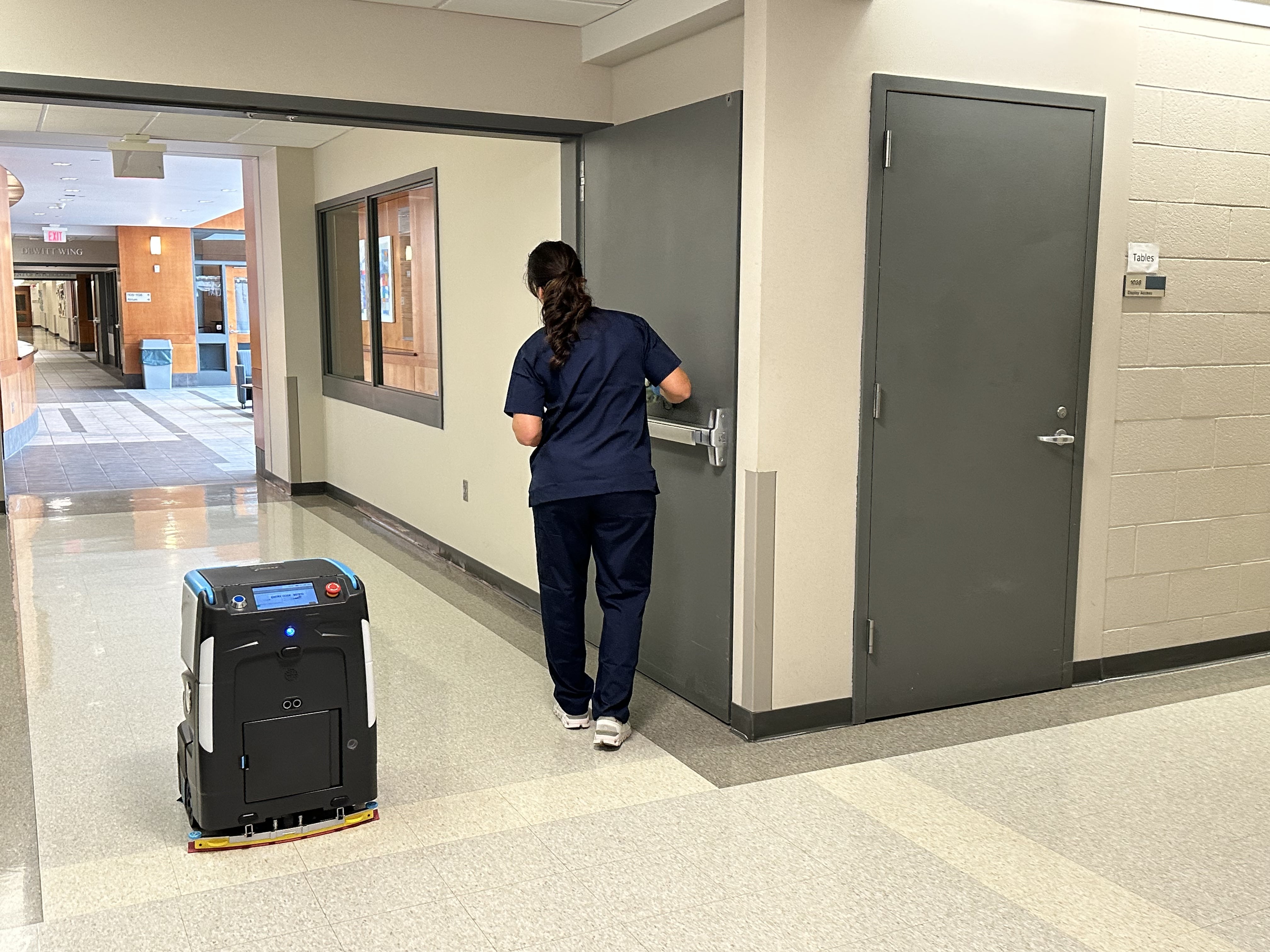 healthcare facility cleaning staff working next to Cobi 18