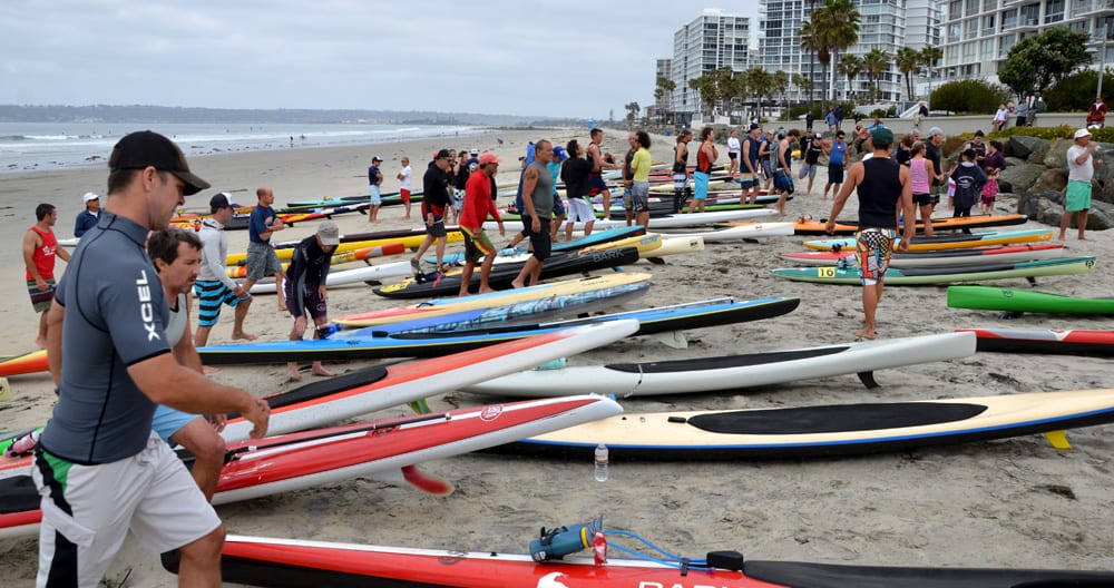 paddle board racers prepare for the start of the coronado loop prone paddle board race