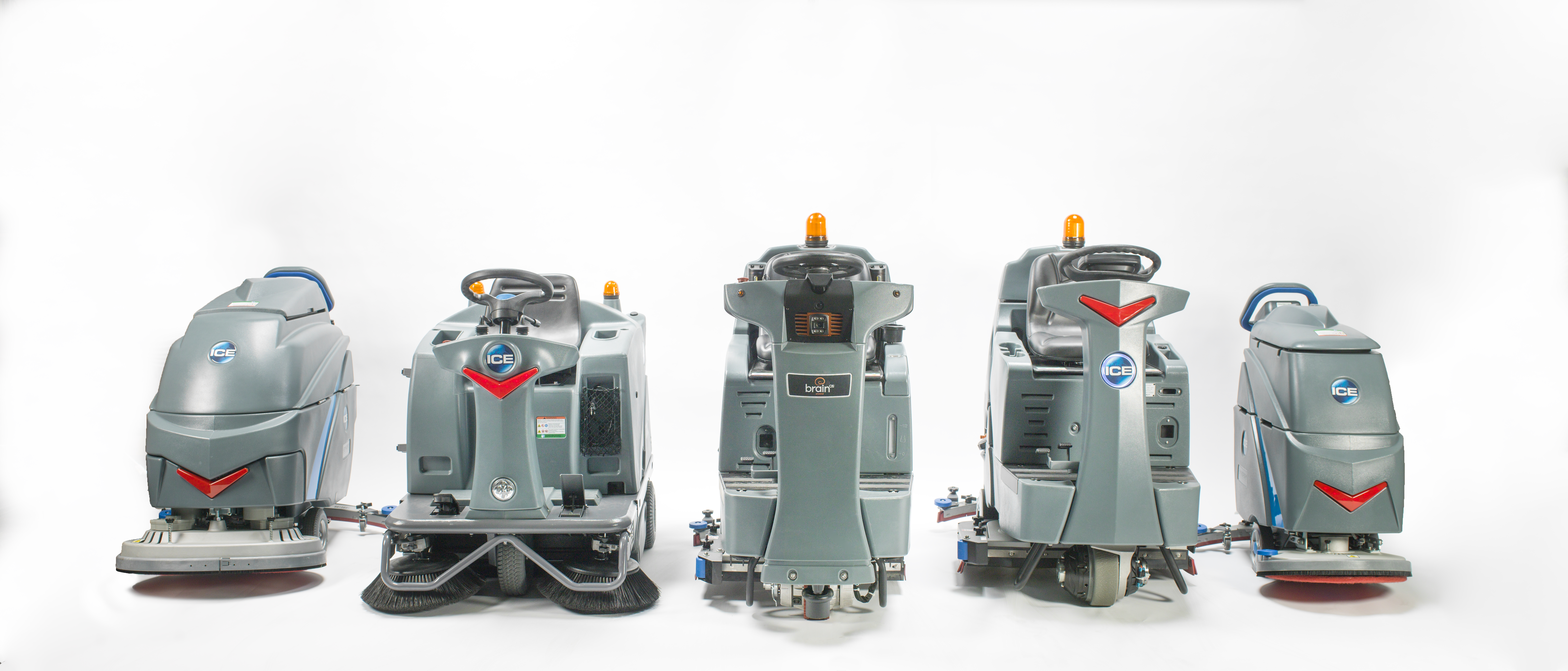 line up of commercial cleaning equipment machines: walk-behind and ride-on scrubbers