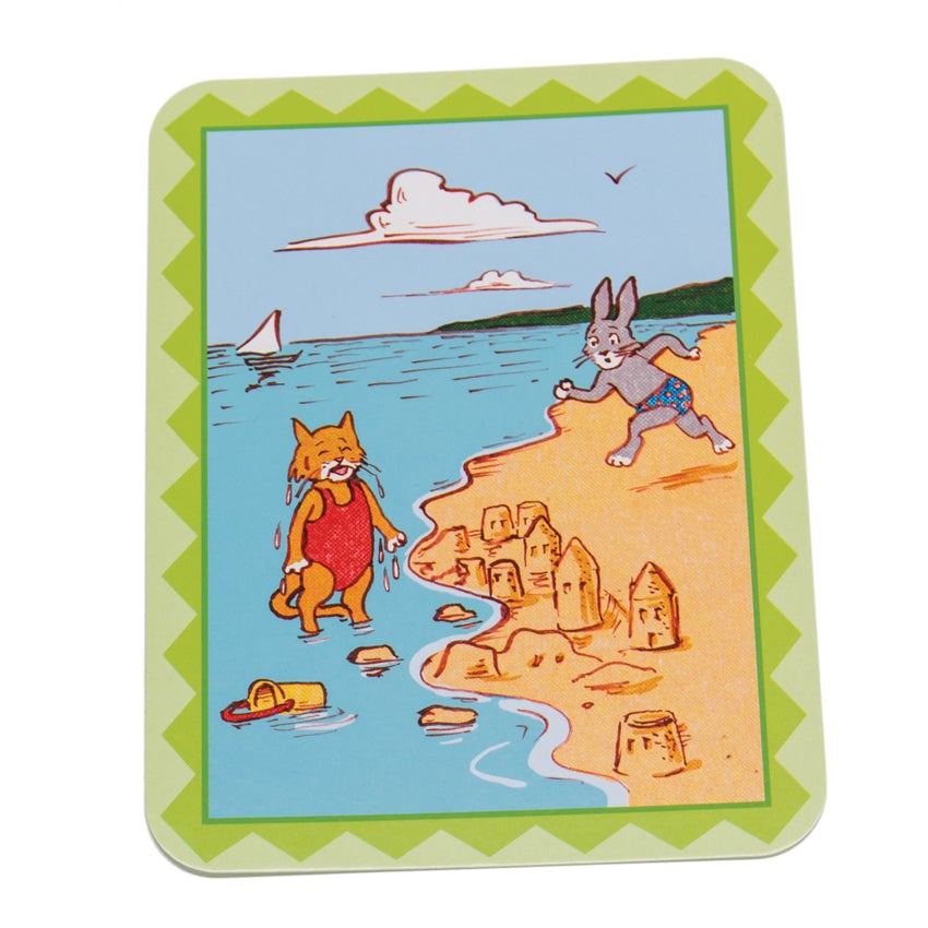 What’s Going on Here Conversation Card of a cat standing in the ocean, sad about her sand castle being washing away by the water. A concerned bunny is running to the cat. You can see a sailboat and clouds in the background. The edge of the card is green with a zig-zag pattern and a lighter green on the other side.