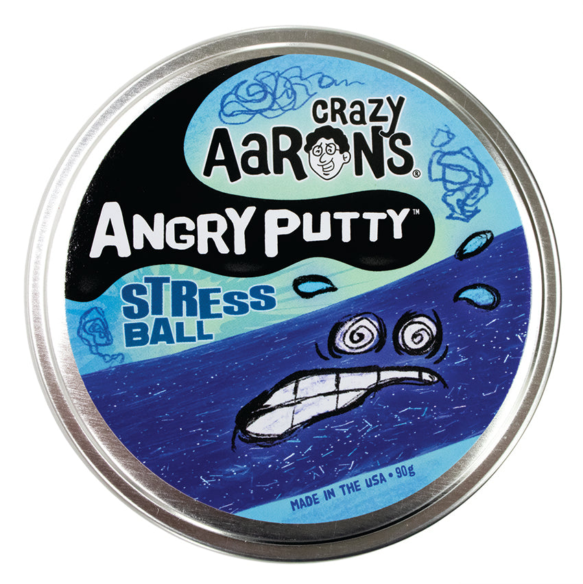 Crazy Aaron’s Angry Putty, Stress Ball container with the lid shut. The large, round, silver tin has a sticker on top that shows a drawn stressed face with sweat beads splashing from the face on top of a band of putty stretched across the label. You can see small rectangle and circle shaped glitter inside the putty, shining in silver through the dark-blue putty. The background colors are blue with some dark blue squiggles doodled randomly on the label.