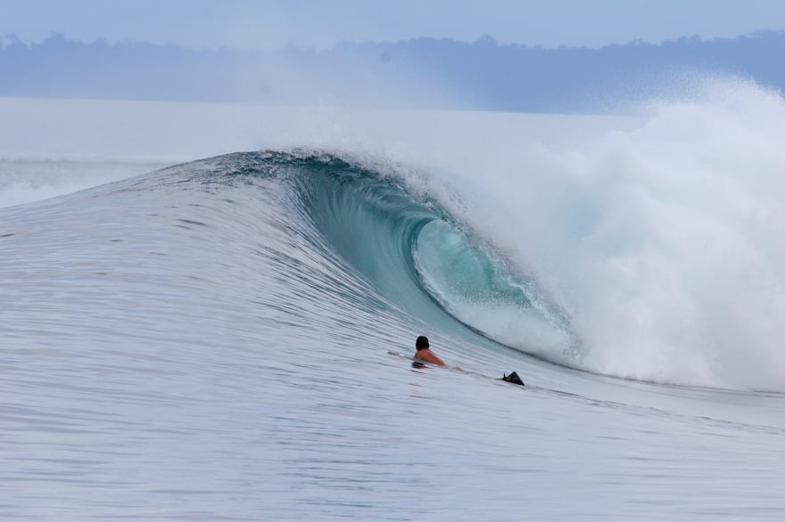 isle friend sapand waits for his turn in the line up Mentawai Islands