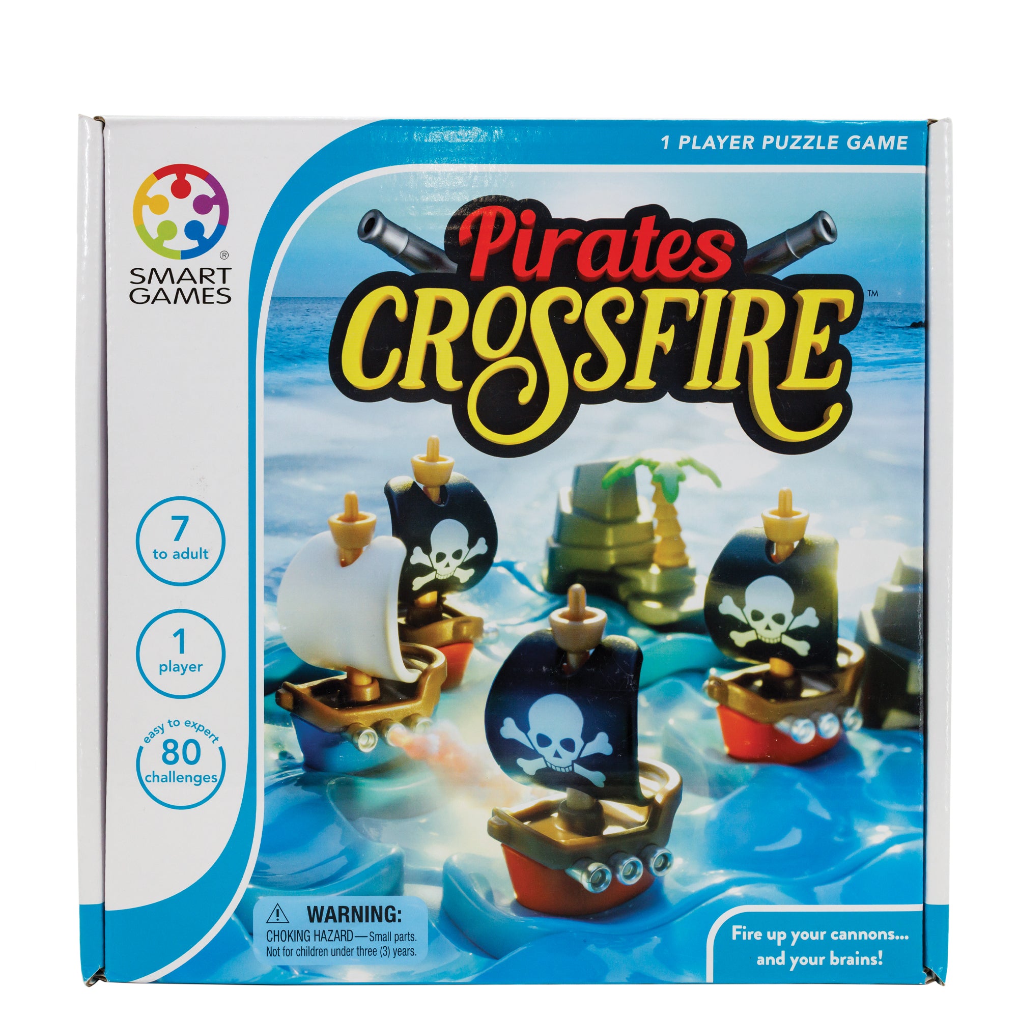 The Pirates Crossfire game box. On the cover is the blue game board with ship and rock pieces placed on top. There are 3 ships with black sails with white skulls, 1 ship with white sails, and 2 rock pieces. You can see the ocean in the background. The left of the box indicated that it is a 1 player game, it’s recommended for age 7 and above, and there are 80 challenges.