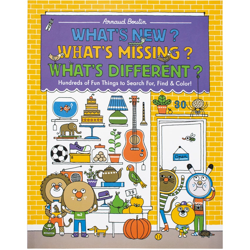 Book cover of "What's New? What's Missing? What's Different?" The cover is an illustrated yellow brick shop building with various household and hobby items displayed in the large window. Several dressed, animal children surround the shop. The title is printed on top of a purple awning located above the display window.