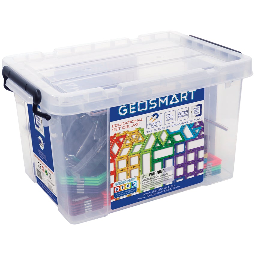 GeoSmart Educational Deluxe set tote box. The large tote is clear plastic with a sticker label showing the pieces inside. The geometrical shaped pieces are stuck together by magnets inside. Each piece is brightly colored. The clear tote has black hinged handles snapped close on the sides. You can see stacks of pieces inside the clear box.