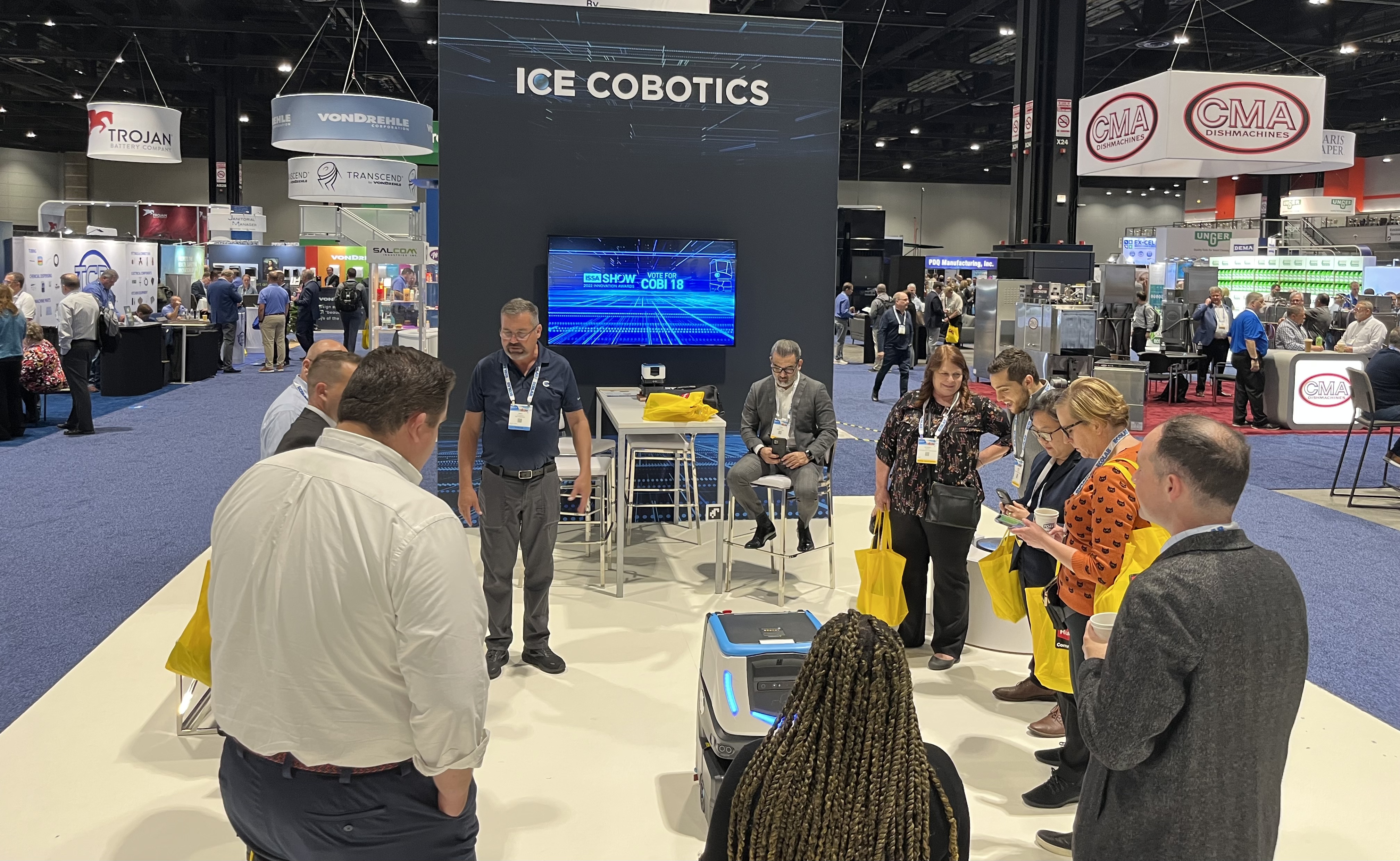 ICE Cobotics team working the booth at ISSA 2022