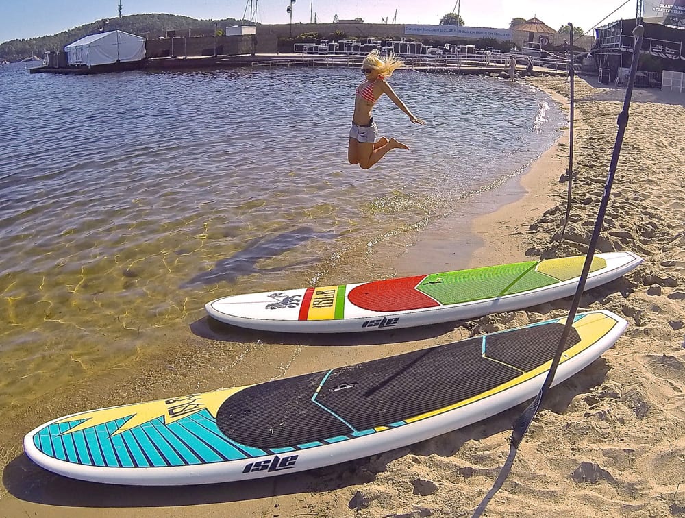 paddle boards on the shores of Kristiansand festival and excited norwegian
