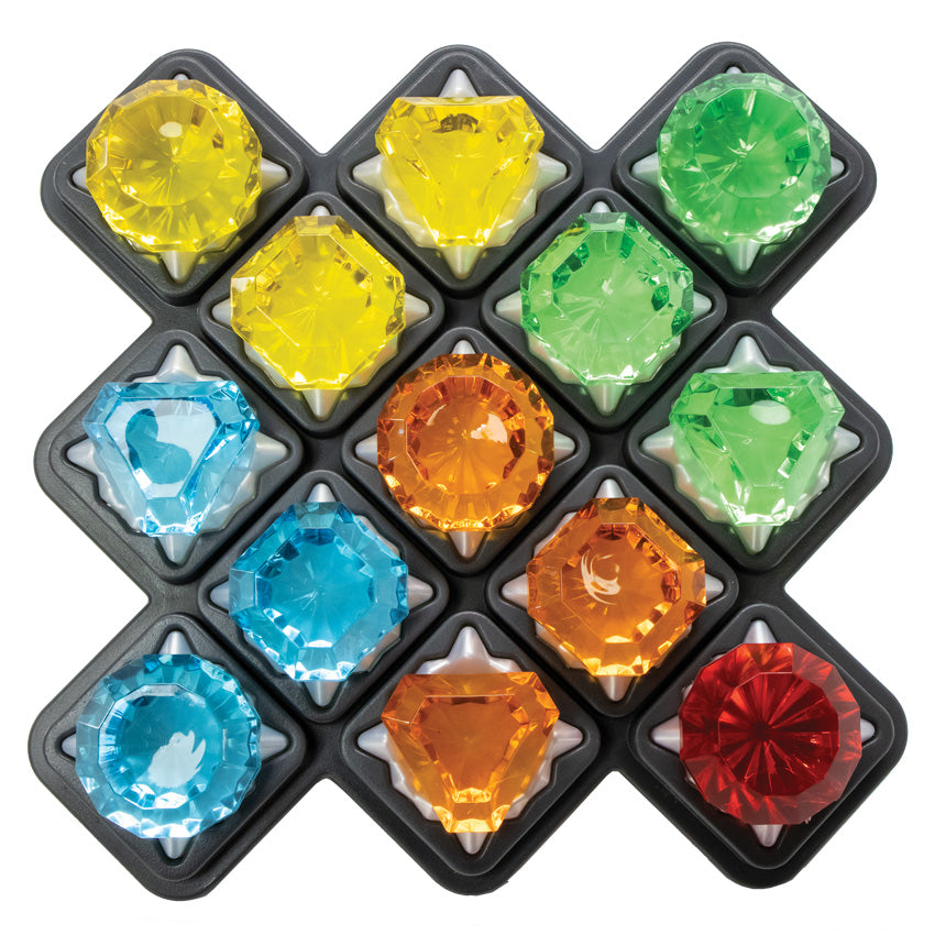 The Diamond Quest Smart Game board with all the gem pieces in place. The gem pieces are red, orange, yellow, green, and blue. There are 3 of each color, but only 1 red in the lower-right corner.