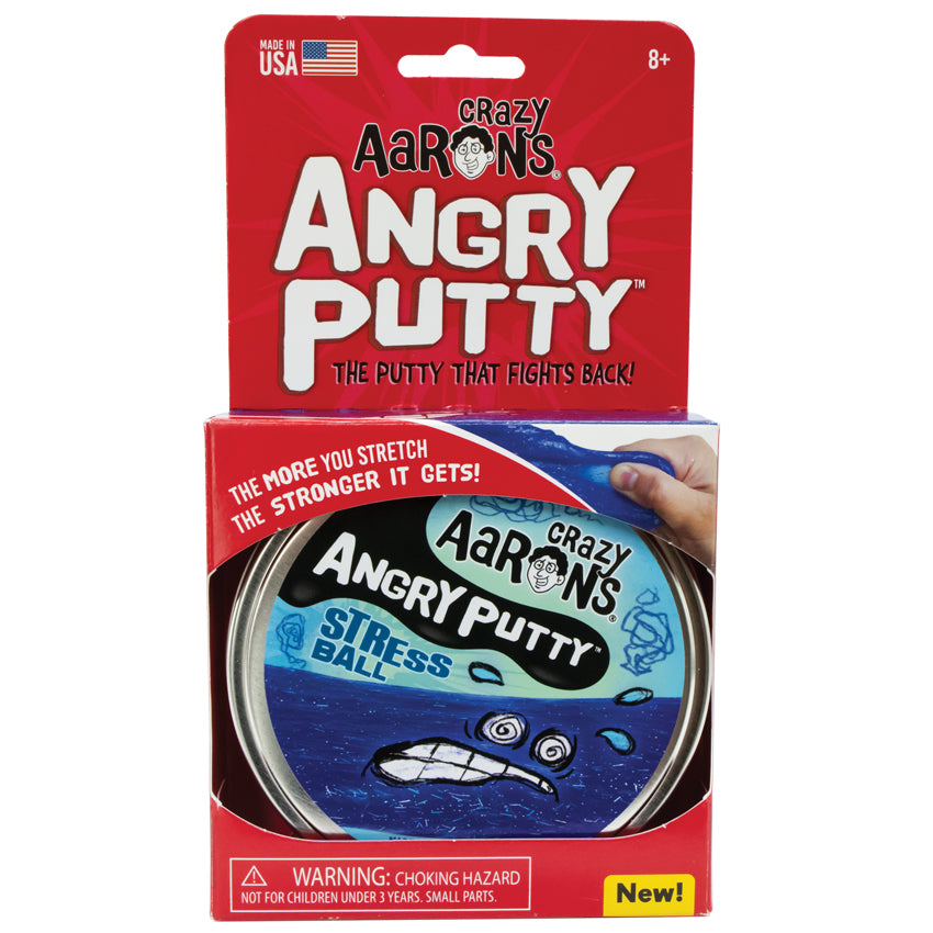Crazy Aaron’s Angry Putty, Stress Ball in packaging. The red, rectangular shaped, paper packaging shows the large, round, silver tin peeking through the bottom. The tin lid sticker has a blue background with dark blue squiggles. There is a stressed face with splashing sweat beads drawn over a band of putty, stretched across the label. You can see small, silver, rectangle and circle shaped glitter inside the dark blue putty. Text on the package reads “The more you stretch, the stronger it gets.”