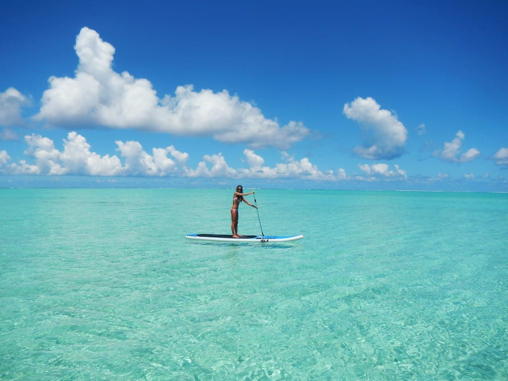 paddling around on a clear day in the open ocean in bora bora