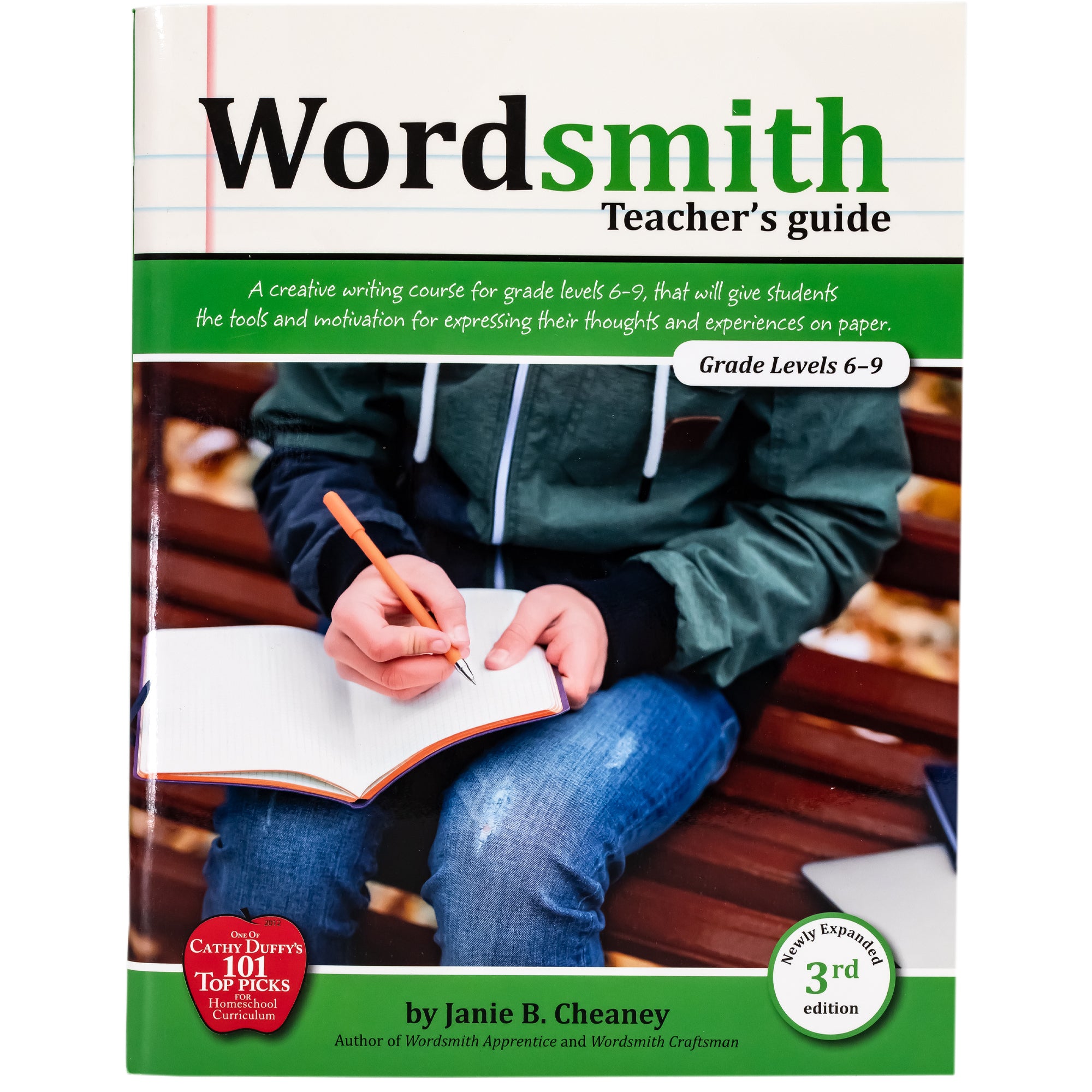 Wordsmith Teacher's Guide cover. The background shows notebook paper at the top and 2 green bands under. Between the green bands is a picture of a boy writing in a journal.