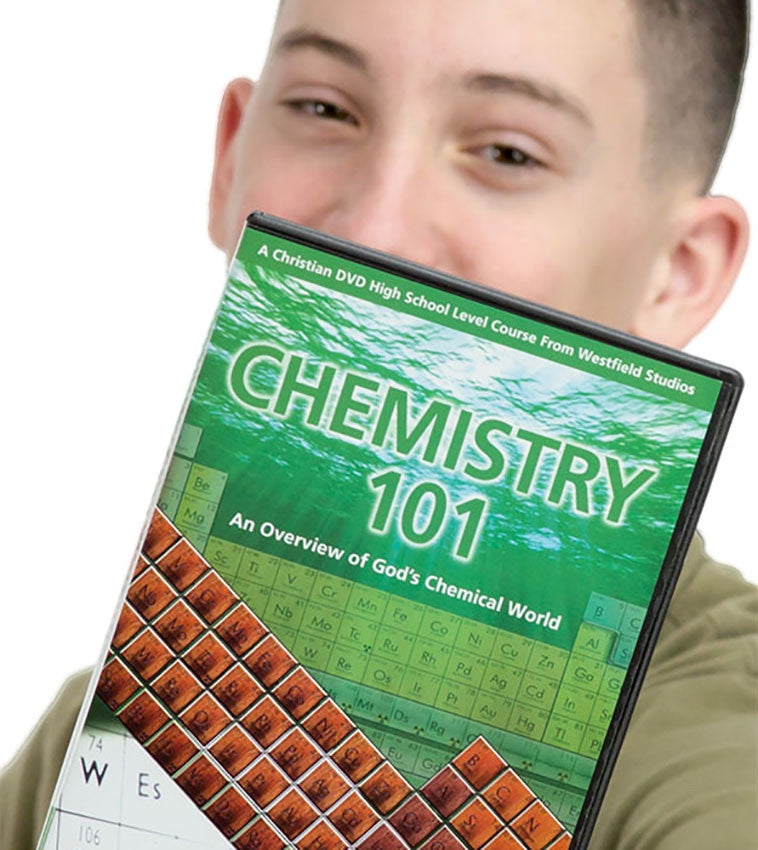 A teenage boy with smiling eyes holding the Chemistry 101 DVD in front of his face. The Chemistry 101 DVD case is mostly green. The background has green colored water at the top and leads down into a periodic table below. Over the top is a brown periodic table.